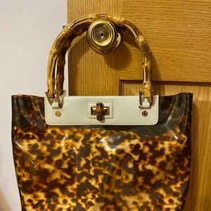 Plastic handbag/bamboo handles